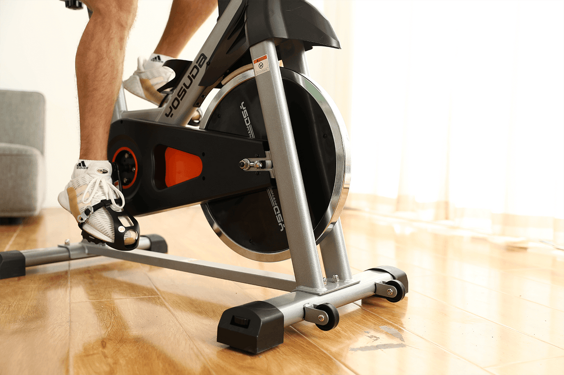 Indoor cycling bike top with a weighted flywheel